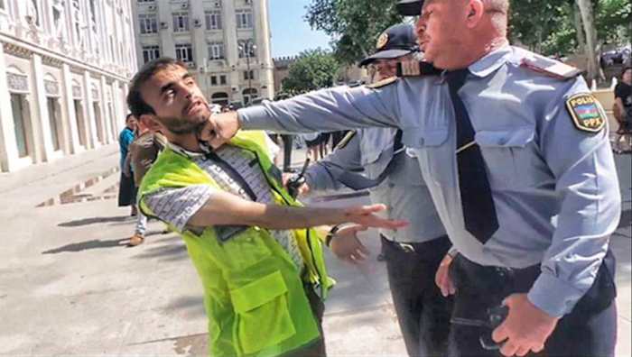 Aliyev went viral in 2013 after he was photographed being punched by a police officer at a protest.